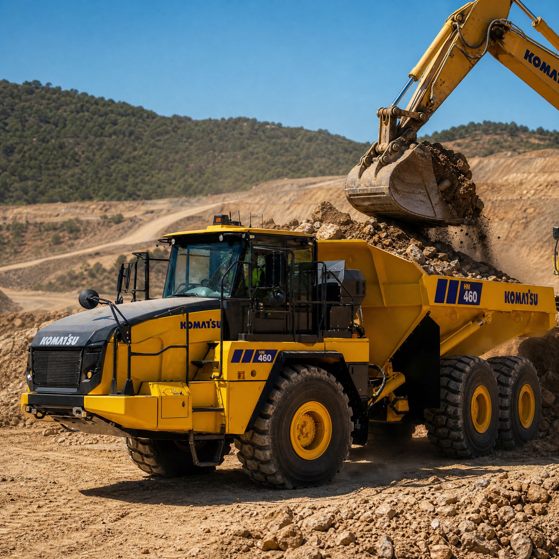 HM460-6 being loaded by an excavator
